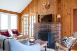 The guest cabin has a rustic feel with cozy furnishings 